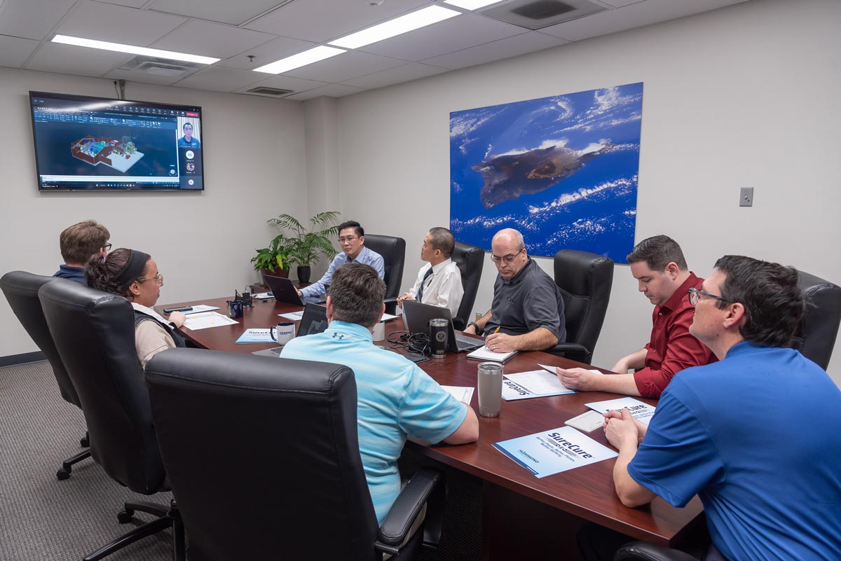 A group of Hammond employees in a meeting.